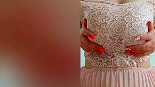 Young cutie teases big tits in pink dress