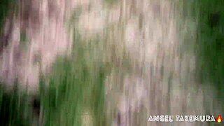 Angel Takemura goes topless for surfers on Grumari beach.