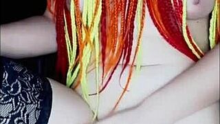 With a lover via video call, she masturbates solo