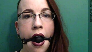 dark lipstick ballgag drooling with intense eye contact