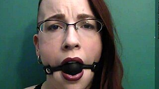 dark lipstick ballgag drooling with intense eye contact