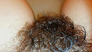 Hairy bush underwater with super hairy pussy lips in tight fetish bathroom video. Dive into this softcore oddity!