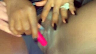 Sexy black model uses vibrator on her tight shaved pussy for white guy