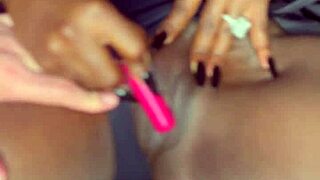 Sexy black model uses vibrator on her tight shaved pussy for white guy