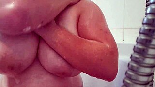 Busty teen washing and massaging her soapy natural breasts 😜