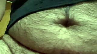 i was playing with my foreskin and balls before shooting my load into the camera