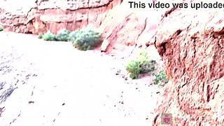 She revealed her cute face with glasses during a deep blowjob in a stunning canyon.