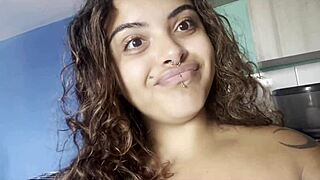 Naked curvy beauty sipping coffee and chatting with camera