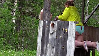 mature lesbians with big asses caught outdoors by voyeur's hidden camera.