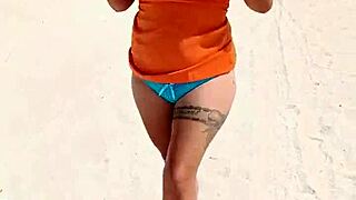 Damn, Mexican slut flashing thong and tits on public beach!