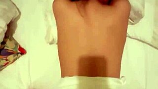 intimate asian teen couple shares bedroom moment