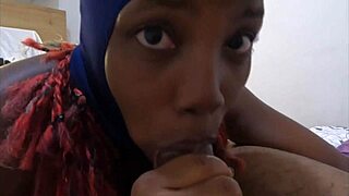 In a thrilling scene, the ebony cumslut in a ski mask gives a sloppy deepthroat to mastermeat1, showcasing her kinky fetish skills.