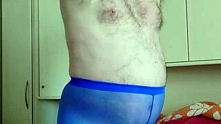 chubby german woman enjoys solo masturbation in blue leggings in her bedroom, playing with her feet and small cock