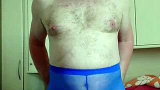 chubby german woman enjoys solo masturbation in blue leggings in her bedroom, playing with her feet and small cock