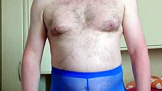 chubby german woman enjoys solo masturbation in blue leggings in her bedroom, playing with her feet and small cock