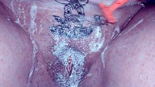 watch this milf shave her trimmed pussy up close with lots of soap