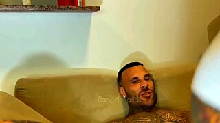 rangel carlos moans as he licks the tattooed guy's big cock