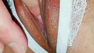 Asian Close-Up Reveals Tight Wet Pussy Details