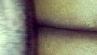 Ebony couple enjoys intimate moments together.