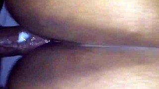 Ebony couple enjoys intimate moments together.