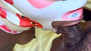 Masked performer deep throats a big black cock in POV.
