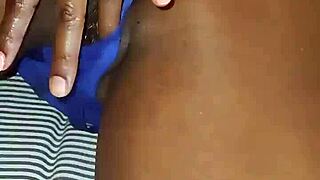 Ebony latina milf fingers herself to orgasm in blue lingerie.