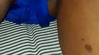 Ebony latina milf fingers herself to orgasm in blue lingerie.