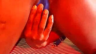 Ebony latina milf fingers herself to orgasm in blue lingerie.