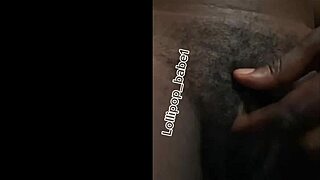 Check out this sexy black babe getting horny at home after smoking and shaking her ass