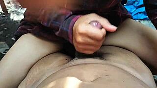 Asian teen maid gives blowjob and handjob to employer behind house