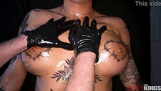 Tattooed brunette hottie gets oiled up for a sensual massage, then bends over in doggystyle anal with big tits bouncing