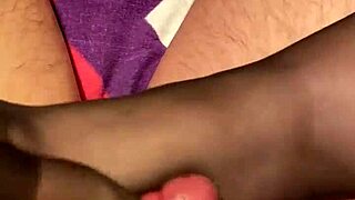 Giving husband a foot massage in stockings