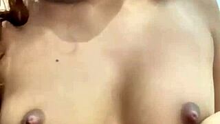 Young girl reveals her body and reaches orgasm