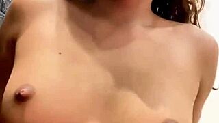 Young girl reveals her body and reaches orgasm