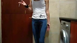 She pees in her jeans while smoking and stripping at home