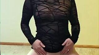 Cute wife Scarlettraven performs a striptease and poses doggystyle for the camera.