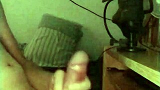 On a rainy day, this skinny young solo amateur jerks off his big monster cock in a sexy session.