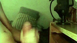 On a rainy day, this skinny young solo amateur jerks off his big monster cock in a sexy session.