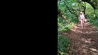 this naughty housewife is naked and wanking in the forest, reaching orgasm outdoors.