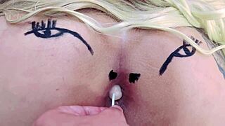 Check out this huge tattooed ass spreading with anal toys in sheer red