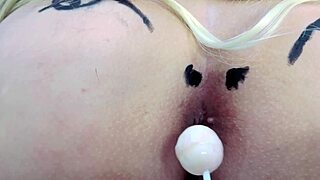 Check out this huge tattooed ass spreading with anal toys in sheer red