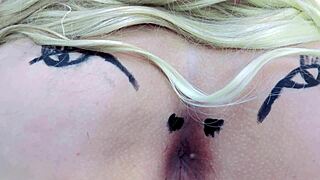 Check out this huge tattooed ass spreading with anal toys in sheer red