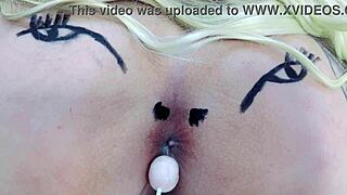 Check out this huge tattooed ass spreading with anal toys in sheer red