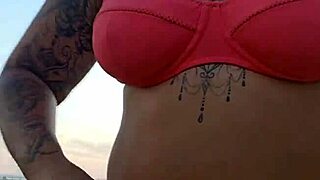 african milf flashes big ass on beach looking for virgin