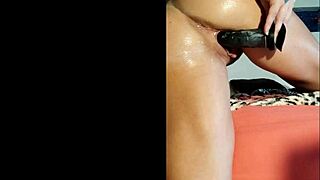 Horny Brunette Inserts Full Toy in Oiled Ass