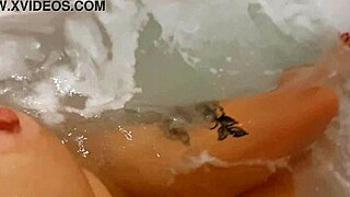 pretty woman masturbates in hot tub