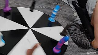 Wheel of dildos she wants to win her orgasm here