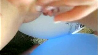 Sophie in jeans miniskirt and red lingerie fingering her pussy with two fingers on webcam