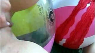 Sophie in jeans miniskirt and red lingerie fingering her pussy with two fingers on webcam