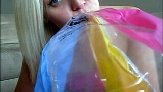 Sophie in jeans miniskirt and red lingerie fingering her pussy with two fingers on webcam